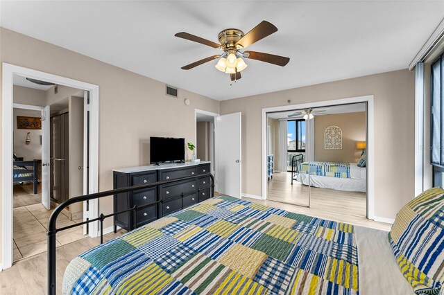 3655 Scenic Highway 98 Unit 503B, Destin, FL 32541 - bedroom with baseboards, wood finished floors, and a ceiling fan
