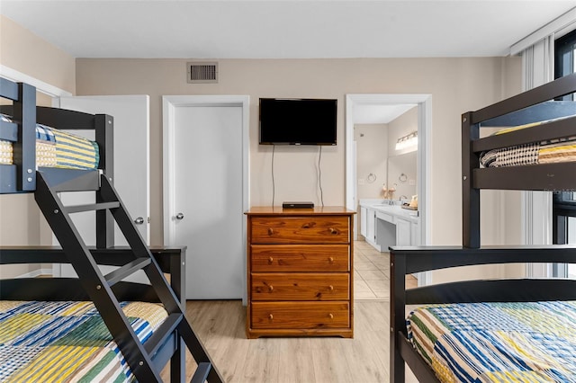 3655 Scenic Highway 98 Unit 503B, Destin, FL 32541 - bedroom featuring light wood-style floors and ensuite bathroom