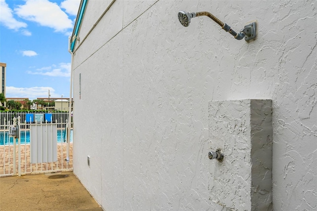 3655 Scenic Highway 98 Unit 503B, Destin, FL 32541 - view of home's exterior with a community pool and stucco siding