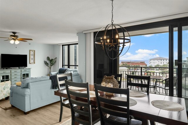 3655 Scenic Highway 98 Unit 503B, Destin, FL 32541 - dining room with a chandelier, light wood-style flooring, a ceiling fan, and floor to ceiling windows