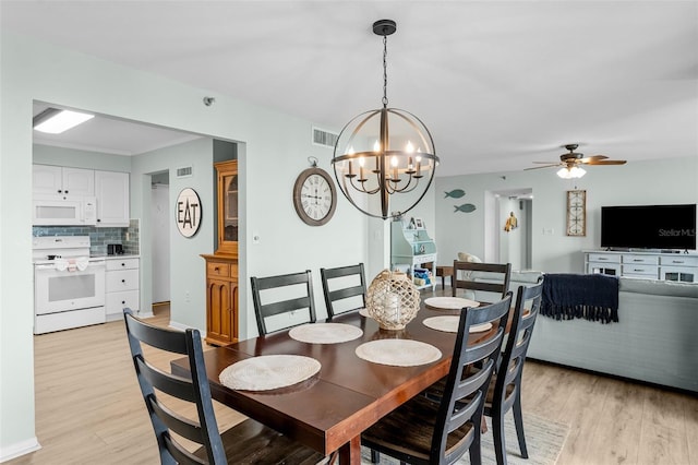 3655 Scenic Highway 98 Unit 503B, Destin, FL 32541 - dining space featuring light wood-style floors, a chandelier, and a ceiling fan