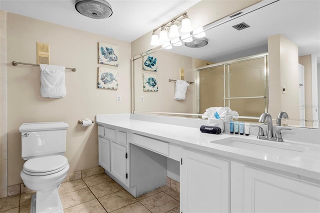 3655 Scenic Highway 98 Unit 503B, Destin, FL 32541 - bathroom with toilet, vanity, an enclosed shower, tile patterned floors, and baseboards