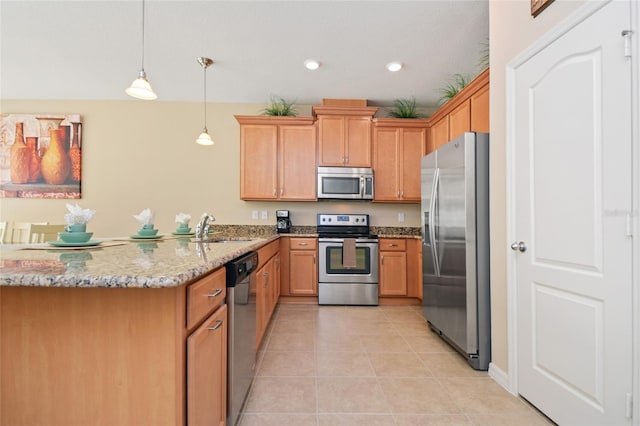 kitchen featuring sink, light tile patterned floors, kitchen peninsula, stainless steel appliances, and light stone countertops