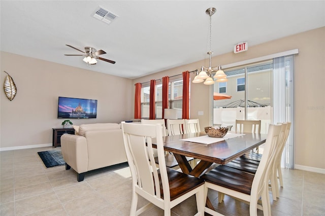 dining space featuring ceiling fan and light tile patterned floors