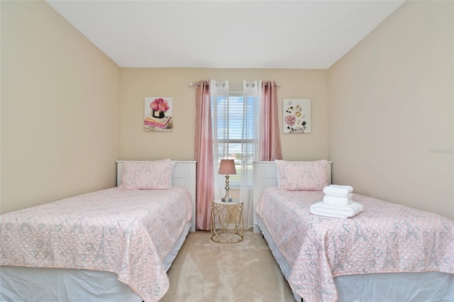 bedroom featuring light carpet