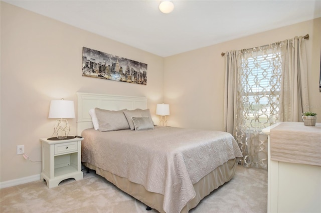 bedroom featuring light colored carpet