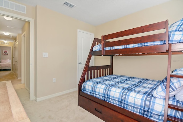 bedroom featuring light carpet