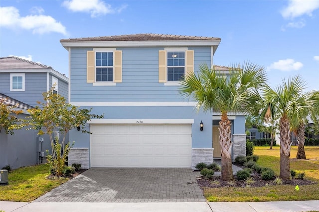 view of front of property with a garage