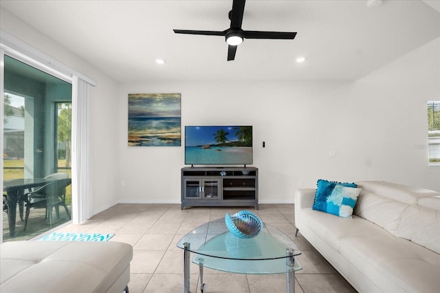 living room featuring light tile patterned flooring and ceiling fan