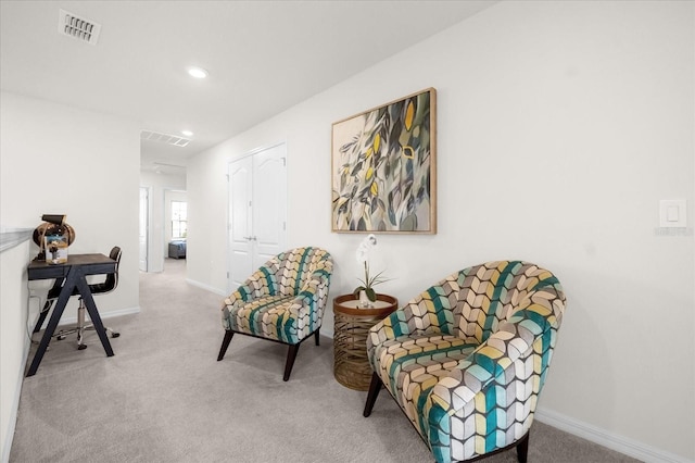 living area with carpet floors