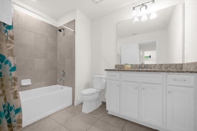 full bathroom with tile patterned flooring, vanity, toilet, and shower / bath combo with shower curtain