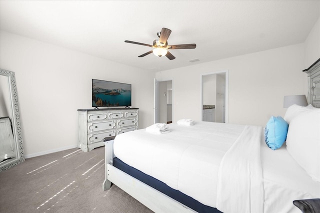 carpeted bedroom featuring ceiling fan and connected bathroom