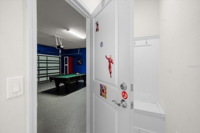 game room with billiards and a textured ceiling