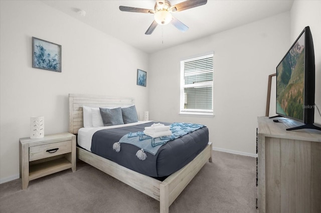 bedroom featuring ceiling fan and light carpet