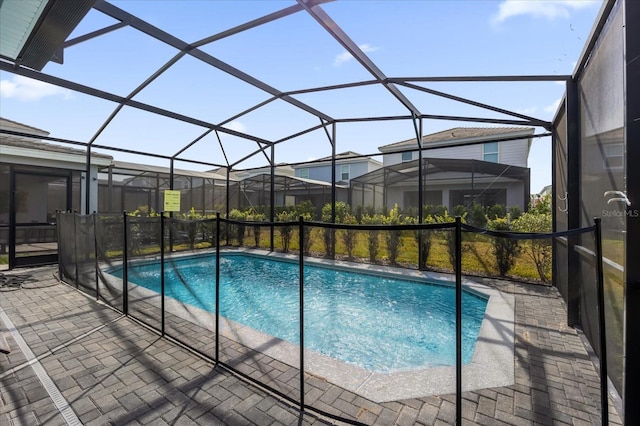 view of pool featuring a patio and a lanai