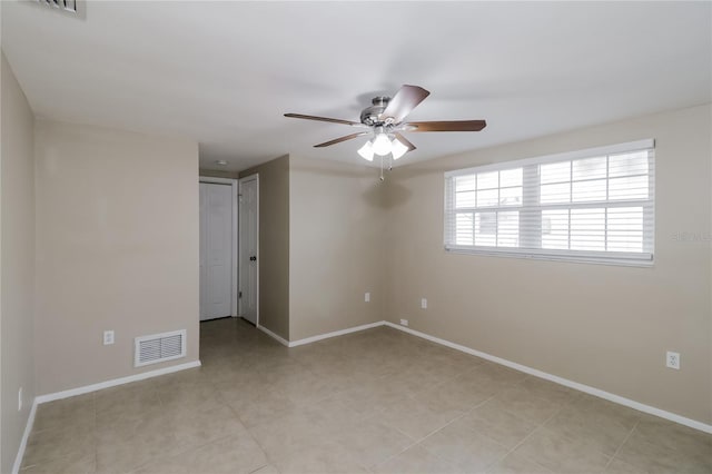 unfurnished room with ceiling fan