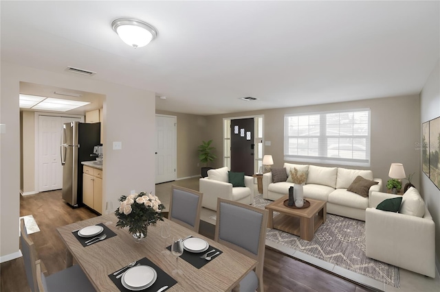 dining area with hardwood / wood-style floors