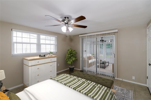 tiled bedroom featuring ceiling fan and access to exterior