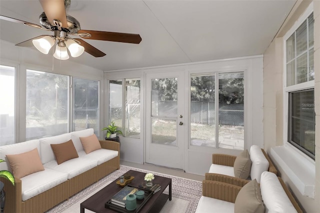 sunroom featuring ceiling fan