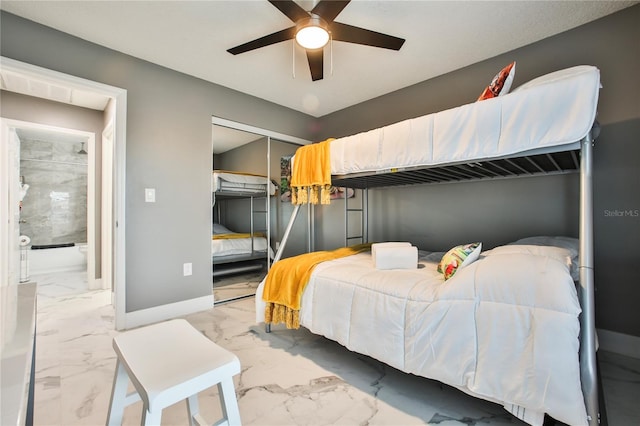 bedroom featuring a closet, ceiling fan, and ensuite bathroom