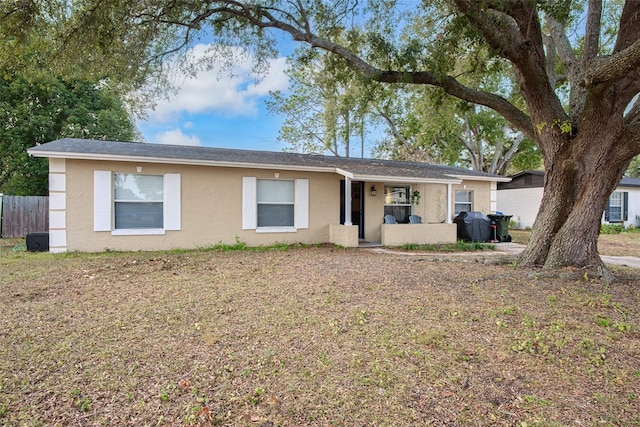 single story home with covered porch