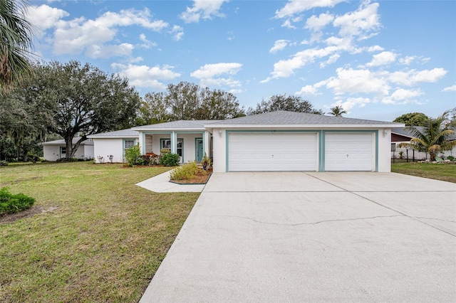 single story home featuring a garage and a front lawn