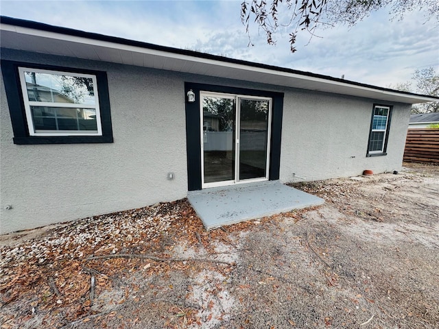 back of property with a patio area