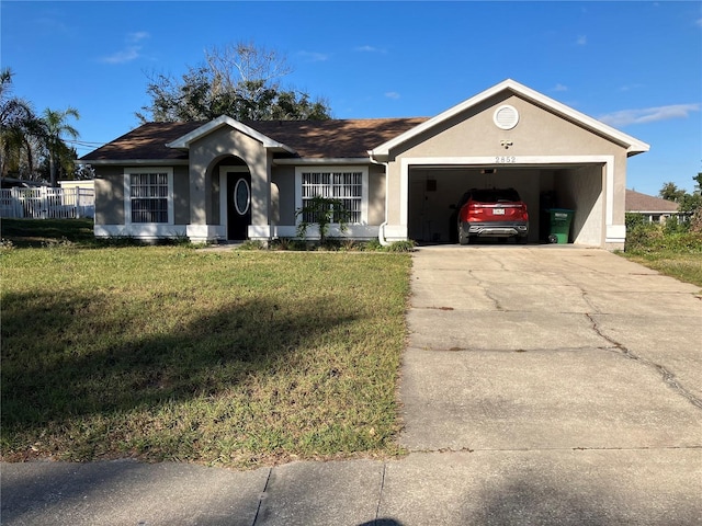 ranch-style home with a garage and a front lawn