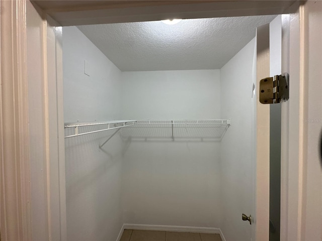 walk in closet featuring tile patterned floors