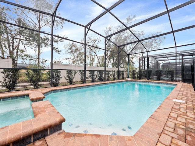 view of swimming pool featuring a lanai and a patio