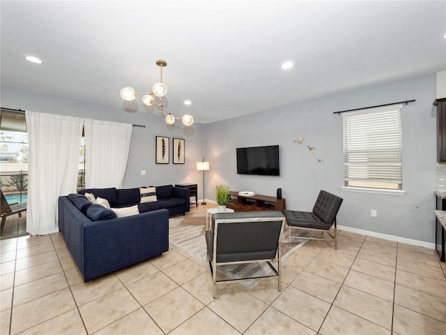 living room featuring light tile patterned floors and a chandelier