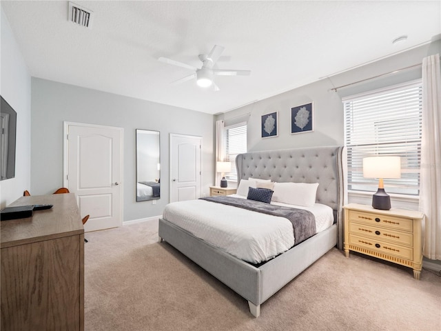 carpeted bedroom featuring ceiling fan