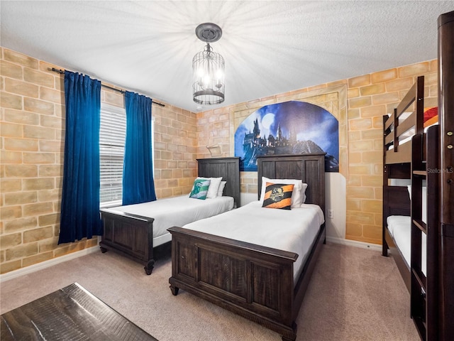 carpeted bedroom featuring an inviting chandelier and a textured ceiling