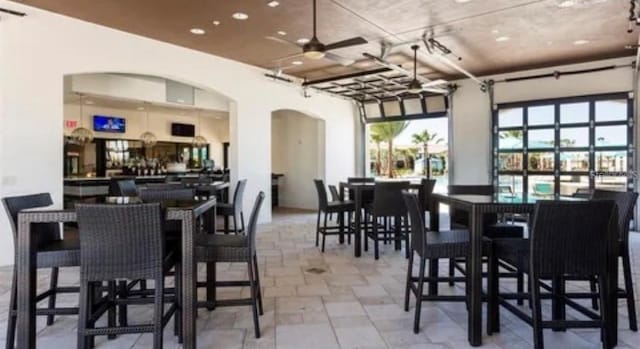 dining room featuring ceiling fan