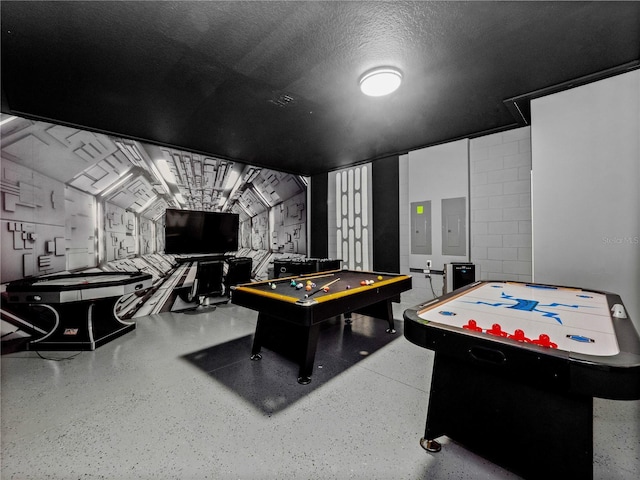 game room with billiards, a textured ceiling, and electric panel