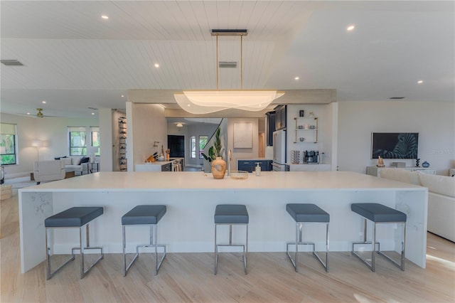 kitchen featuring a kitchen breakfast bar and a spacious island