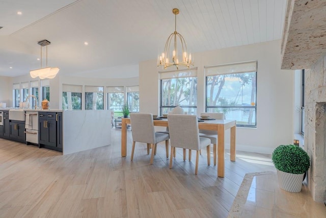 dining room featuring wood ceiling, an inviting chandelier, and light wood-type flooring