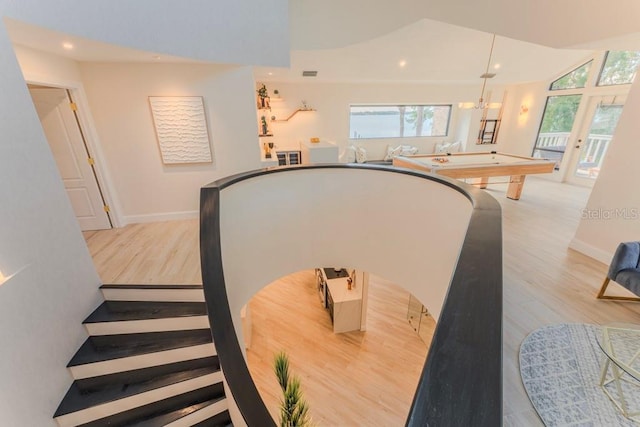 staircase featuring wood-type flooring