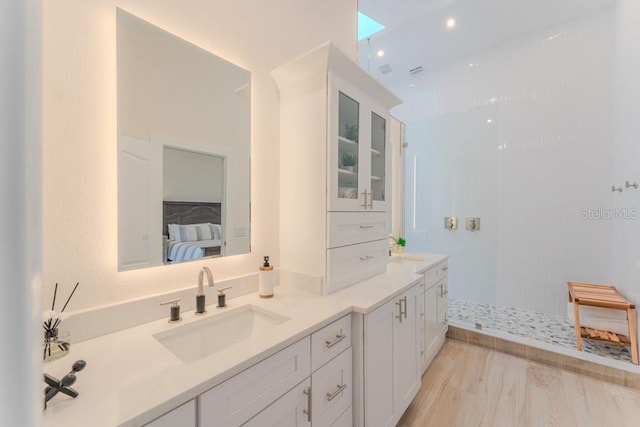 bathroom with vanity and walk in shower