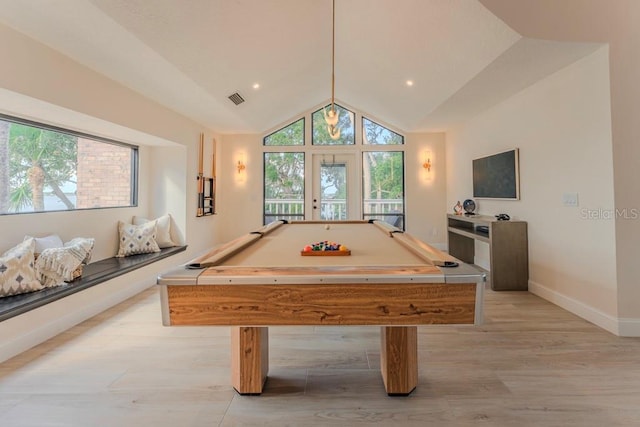 playroom with lofted ceiling, billiards, a wealth of natural light, and light hardwood / wood-style flooring