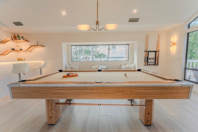 playroom featuring billiards, a wealth of natural light, and light hardwood / wood-style floors