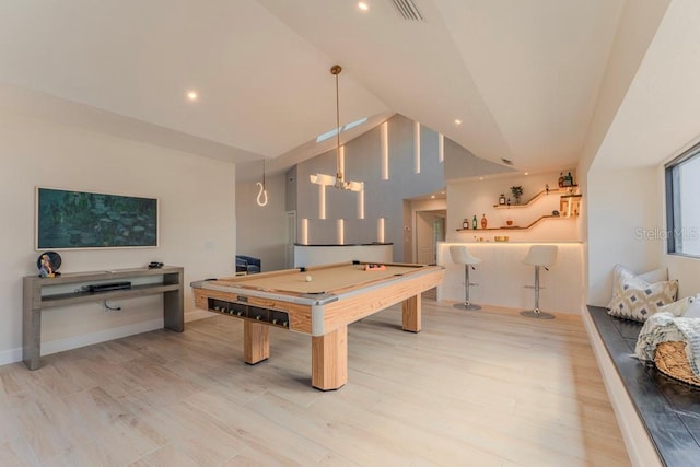 rec room featuring vaulted ceiling, light hardwood / wood-style flooring, and billiards