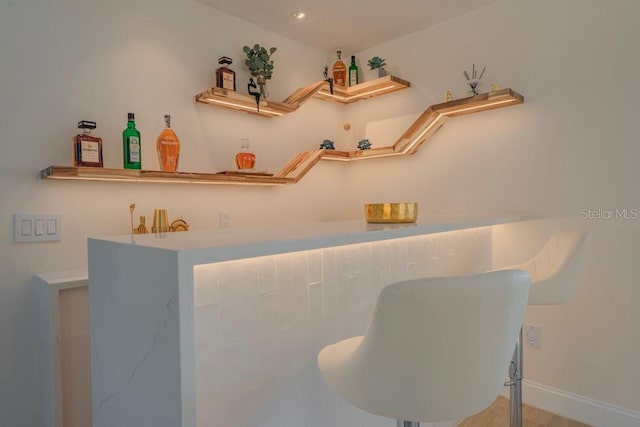 bar featuring hardwood / wood-style floors