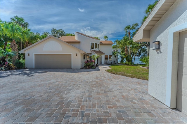 view of front of property with a garage and a front yard