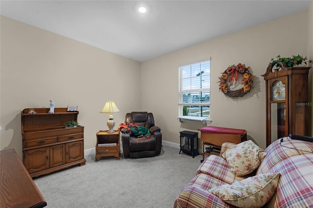 living area with light colored carpet