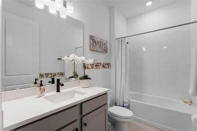 full bathroom with vanity, tile patterned floors, toilet, and shower / bath combo with shower curtain