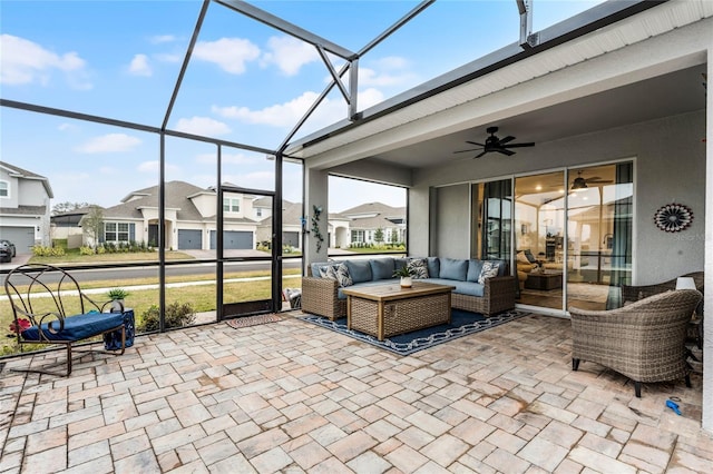 sunroom featuring ceiling fan