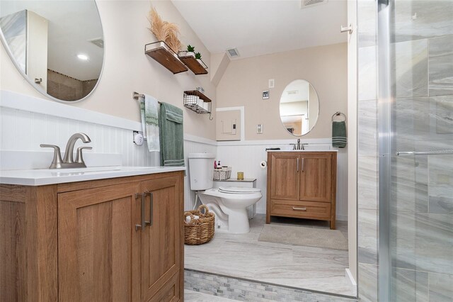 bathroom with vanity, toilet, and an enclosed shower