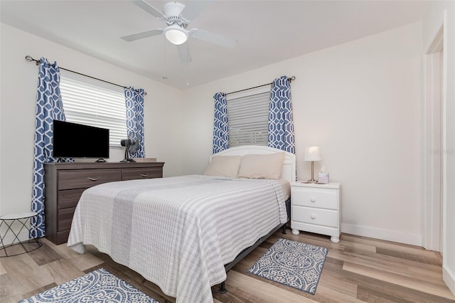 bedroom featuring ceiling fan and light wood-type flooring