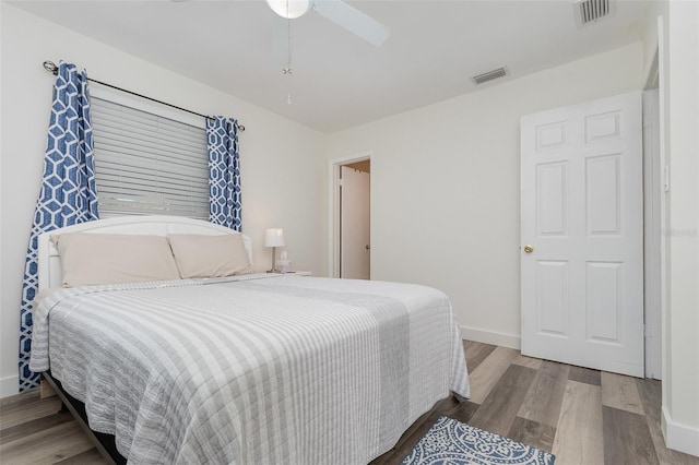 bedroom with hardwood / wood-style flooring and ceiling fan